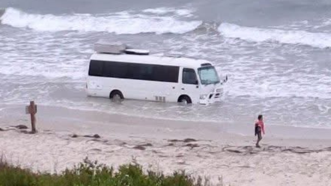 ‘Can’t park there mate’: Bus bogged on Adelaide beach