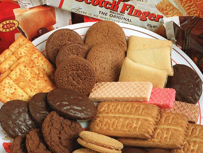 02/05/2001. Plate of various Arnott's Biscuits. Scotch Finger, Ginger Nut, Triple Wafer, Cheds, Orange Slice, Chocolate Mint Slice. Food. Packets.