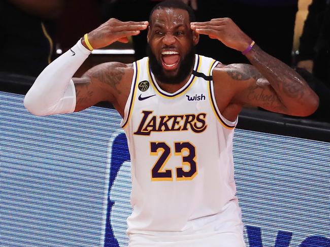 LAKE BUENA VISTA, FLORIDA - OCTOBER 11: LeBron James #23 of the Los Angeles Lakers reacts after winning the 2020 NBA Championship over the Miami Heat in Game Six of the 2020 NBA Finals at AdventHealth Arena at the ESPN Wide World Of Sports Complex on October 11, 2020 in Lake Buena Vista, Florida. NOTE TO USER: User expressly acknowledges and agrees that, by downloading and or using this photograph, User is consenting to the terms and conditions of the Getty Images License Agreement.  (Photo by Mike Ehrmann/Getty Images)