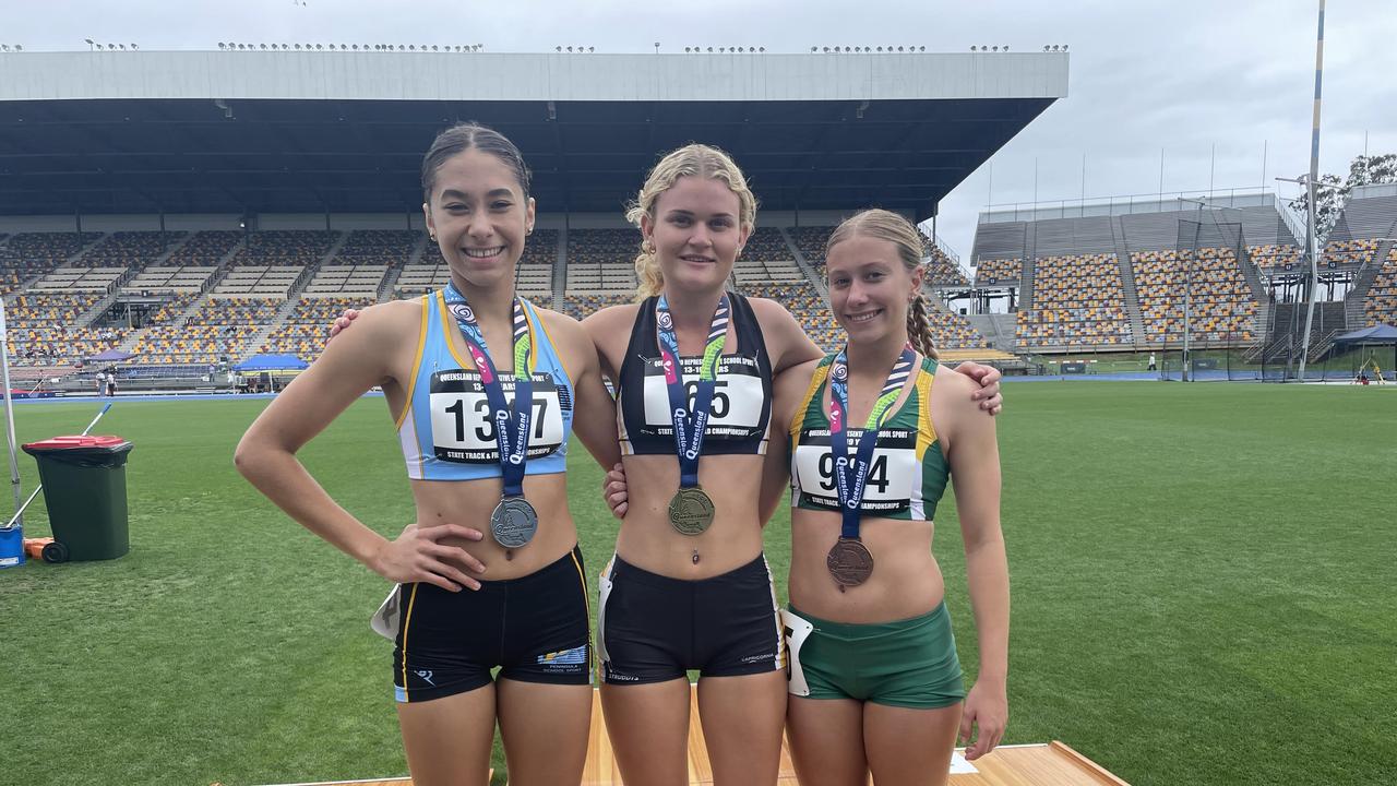 Sharnti Woodham, middle, with Paige Grose and April Fischer, left.