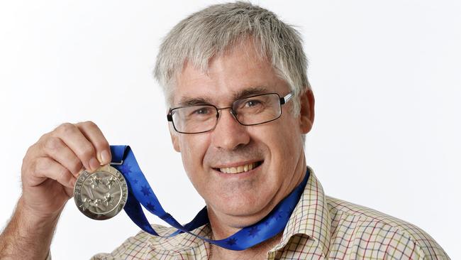 For his work Graeme Sawyer, the driving force behind Darwin’s FrogWatch program, received the Environment Medal  at an award ceremony at Parliament House on Thursday. Picture: Elise Derwin