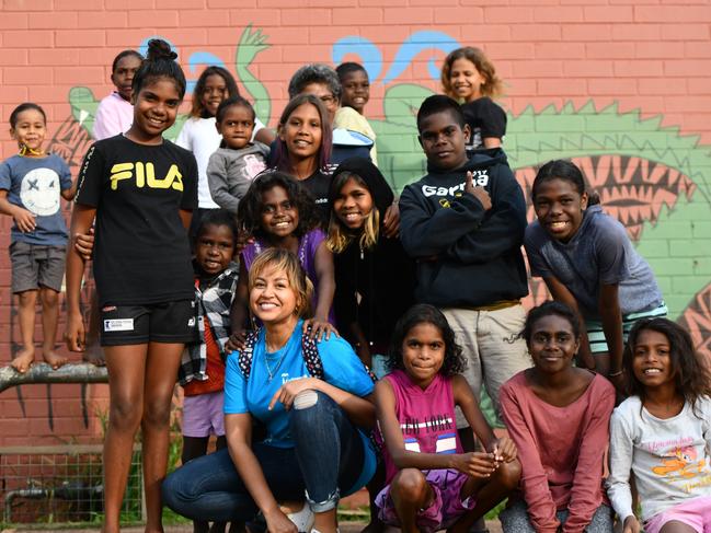 Jessica Mauboy visits the Tiwi Islands for the book launch of Teeny Weeny Yikiyikini by children from Milikapiti School, Melville Island with Gregg Dreise, in 2019. Picture: Wayne Quilliam