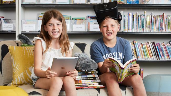 Elyse, 7 and Caleb, 6 at the Parks Library in Angle Park. Picture: Matt Loxton