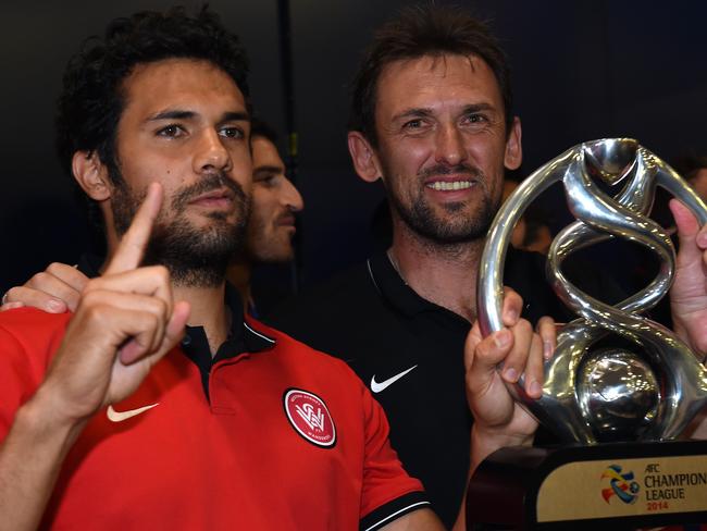 Nikolai Topor-Stanley (left) celebrates Western Sydney Wanderers’ AFC Champions League success in 2014 with then-Wanderers coach Tony Popovic. Picture: Paul Miller / AAP Image