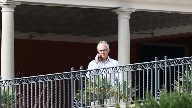 Prime Minister Malcolm Turnbull speaks on his phone at his home in Point Piper. Picture: Tim Hunter.