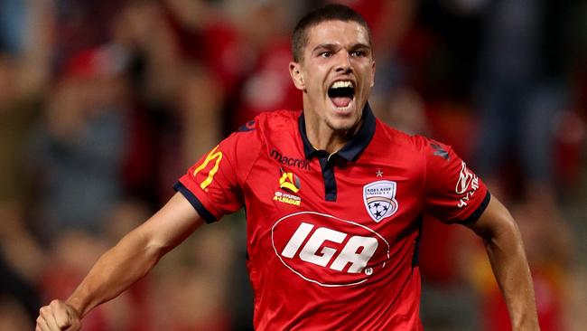 Adelaide United’s George Blackwood celebrates his equaliser in the Reds’ 2-2 draw with Central Coast Mariners. Picture: AAP Image/James Eslby