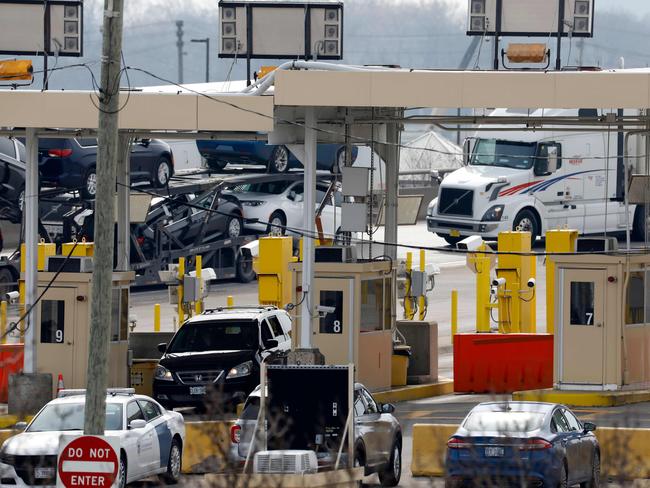 Cars at the US Customs booth at the Ambassador Bridge that connects Windsor, Canada, to Detroit, Michigan. Picture: AFP