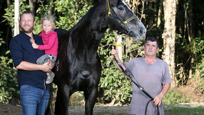 Racehorse owner Chris Jorgensen and his daughter Athena with his horse Taveuni and Cairns Trainer Rodney Miller. PICTURE: STEWART MCLEAN