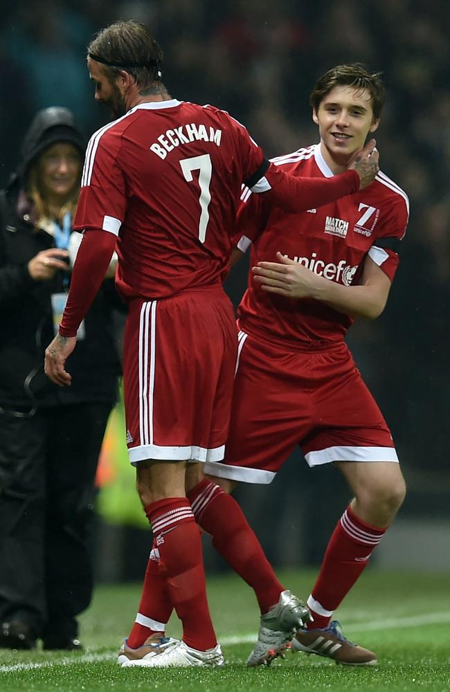 GB and Ireland’s English captain David Beckham is substituted for his son Brooklyn during a charity football match between a Great Britain and Ireland team and a Rest of the World team at Old Trafford in Manchester, on November 14, 2015 in aid of UNICEF. Picture: AFP