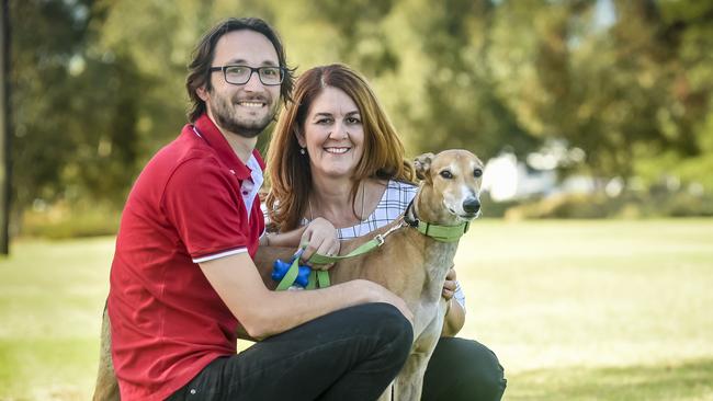 Greyhound owner Jordan Kostadinov with dog Geoffrey and councillor, Elisabeth Papanikolaou, who supported off-leash days in West Torrens. Photo: AAP/Roy VanDerVegt