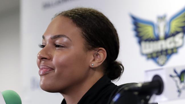 FILE - In this Feb. 26, 2018, file photo, Dallas Wings newly acquired center Liz Cambage, of Australia, responds to questions during a news conference at College Park Center, in Arlington, Texas. Cambage scored 53 points to set a WNBA record Tuesday, July 17, 2018, leading the Dallas Wings to a 104-87 victory over the New York Liberty. (AP Photo/Tony Gutierrez, File)