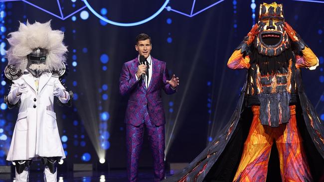 Host Osher Gunsberg with Professor and the Volcano – another two of Tim Chappel’s amazing creations in season 3 of The Masked Singer. Picture: Nigel Wright