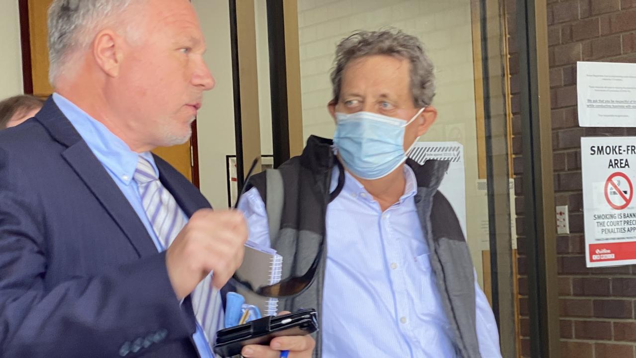 Michael Jerome O'Brien (right) leaves Noosa Magistrates Court with his lawyer after being sentenced on Tuesday.