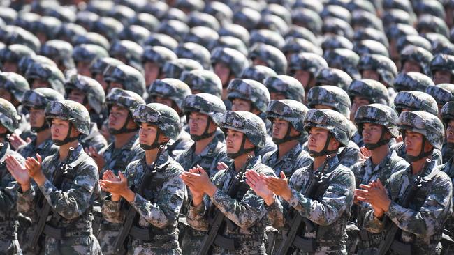 Chinese soldiers applaud during a military parade at the Zhurihe training base in China's north. Picture: AFP Photo