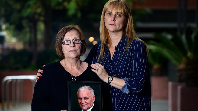 Wife Rina Serpo and daughter Alma Krecu with a picture of their beloved Eddie Serpo. Picture: Bianca De Marchi