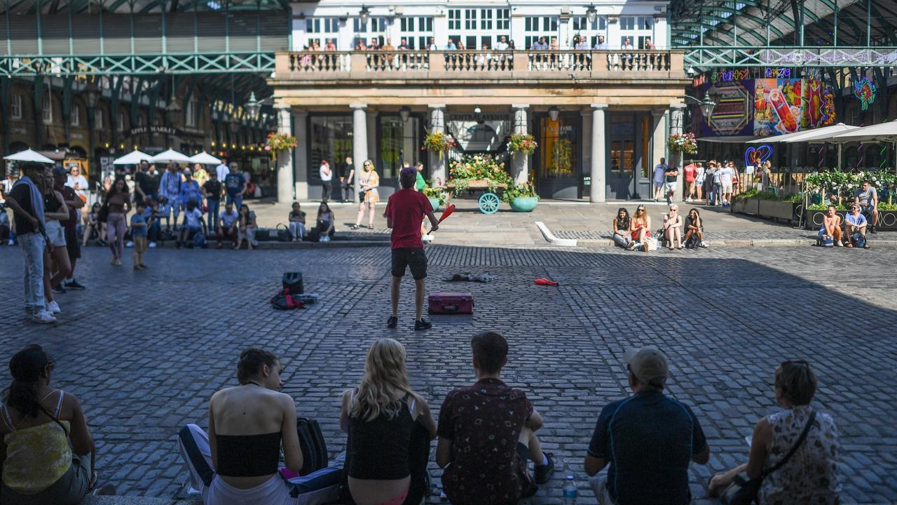 People watch a street performer in Covent Garden. Picture: Peter Summers/Getty Images