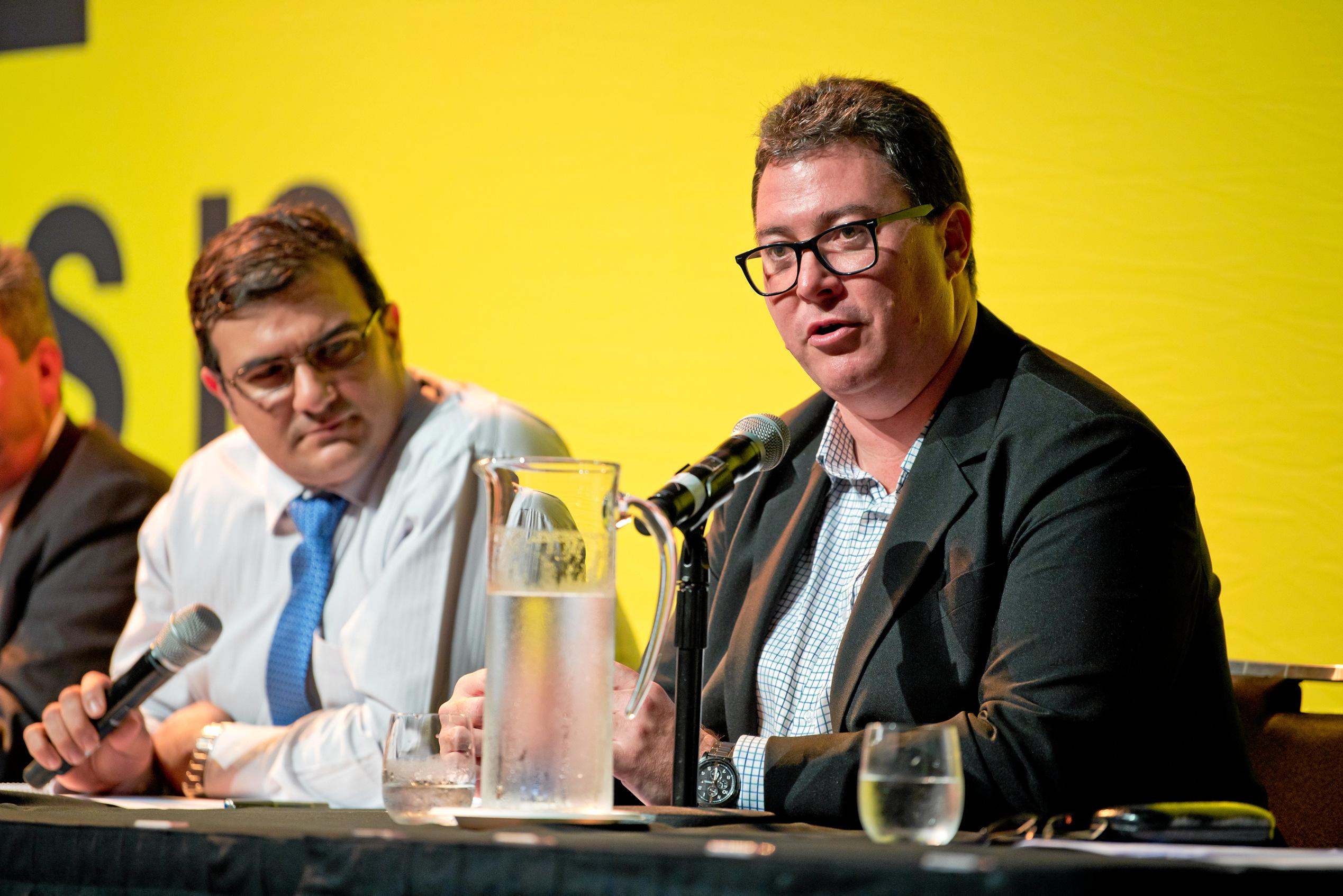 2019 Dawson Debate moderator Simon Vigilante watches George Christensen speaks at the Mackay event on Thursday evening.