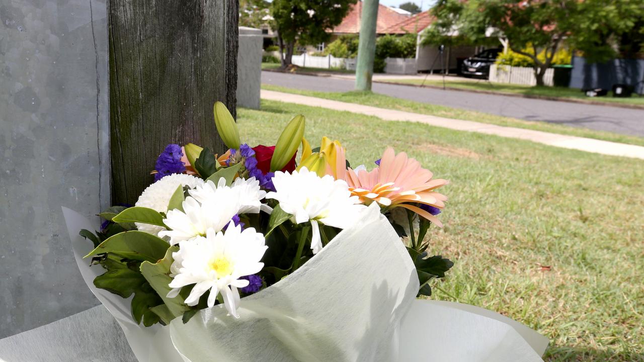 Flowers left at the scene in Raven St, Camp Hill. Picture: Picture: Steve Pohlner