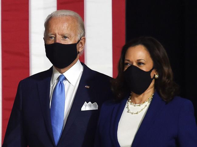 Democratic presidential nominee and former US Vice President Joe Biden (L) and vice presidential running mate, US Senator Kamala Harris, arrive to conduct their first press conference together in Wilmington, Delaware, on August 12, 2020. (Photo by Olivier DOULIERY / AFP)