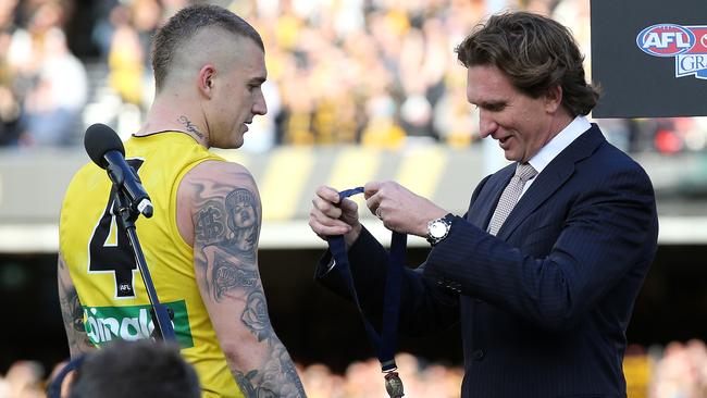 James Hird presents Dustin Martin with the Norm Smith Medal. Picture: Michael Klein