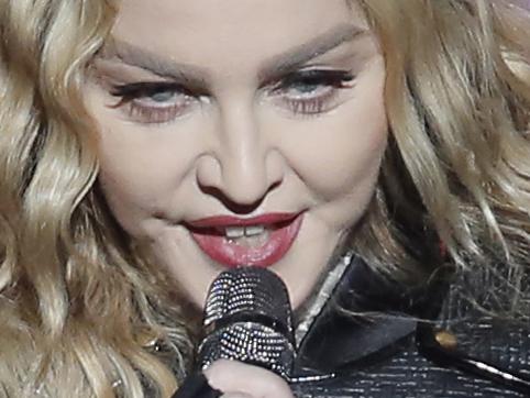 FILE - In this Feb. 20, 2016 file photo, Madonna performs during the Rebel Heart World Tour in Macau, China. Madonna says she would never perform at a concert “high or drunk” in an Instagram post early Tuesday, March 15, 2016. The pop star played off the reported rumors that she appeared drunk onstage during her current world tour. (AP Photo/Kin Cheung)