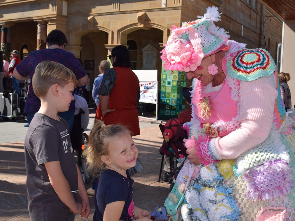 Chase, 7, and Isabella Organ, 4, with Knitted Nancy (Penelope Lowther) at the Stroll &amp; Swing at Jumpers and Jazz in July 2018.