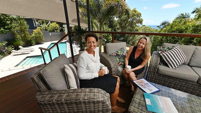 Michele Neylan of Noosa Holiday Rentals, celebrating with inspections officer Erika Drenth, says landlords can pretty much name their price. Picture: Lyndon Mechielsen