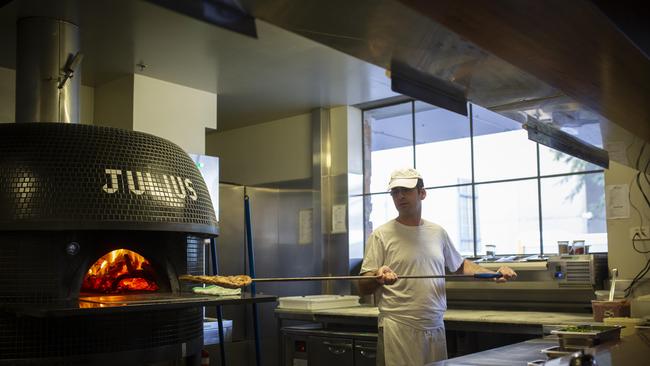 Julius Pizzeria at 77 Grey Street, Southbank, chef Antony Nicastro cooking the Salsicca pizza. Picture: Russell Shakespeare