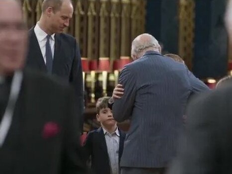 King Charles hugs Prince George during a rehearsal for the coronation. Picture: Supplied