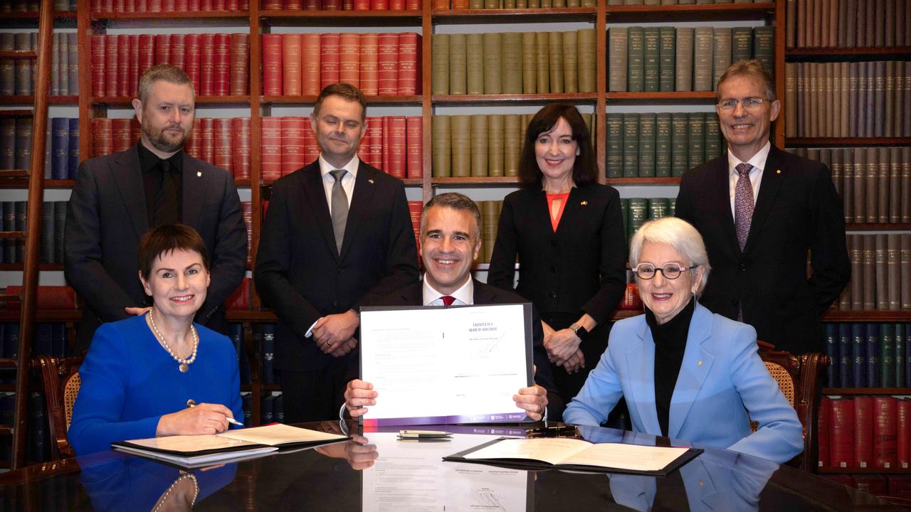 Front (L to R) Chancellor of the University of SA Pauline Carr, Premier Peter Malinauskas, Chancellor of the University of Adelaide Catherine Branson. Back (L to R) Uni SA Vice Chancellor Professor David Lloyd, Treasurer Stephen Mullighan, Deputy Premier Susan Close, University of Adelaide Vice Chancellor Professor Peter Høj at the signing of the agreement for a new university. Picture: Emma Brasier