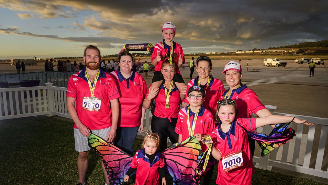 Team Magenta Community Services members (from left) Brad Nixon, Letitia Robarts, Florence Nixon (front), Amber Grandison with Freddy Grandison (on shoulders), Archie Grandison, Jodie Kehl, Scarlette Morey and Penelope Heslop at the Toowoomba Marathon events at Wellcamp Airport, Saturday, May 3, 2025. Picture: Kevin Farmer