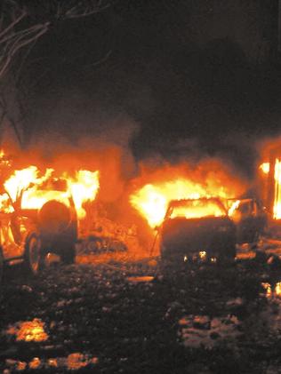 Buildings and cars on fire after the bomb blast exploded on Bali’s tourists strip, killing 202 people. Picture: AFP