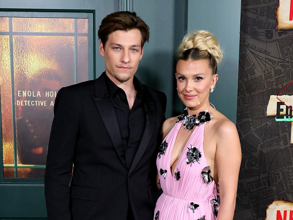 Brown, seen here with husband Jake Bongiovi, sporting lighter locks at the Enola Holmes 2 premiere in 2022. Picture: Theo Wargo/Getty Images