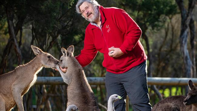 Michael Johnson from Moonlit Sanctuary, which will be allowed to open on June, is pictured with some furry friends who've been missing visitors. Picture: Mark Stewart