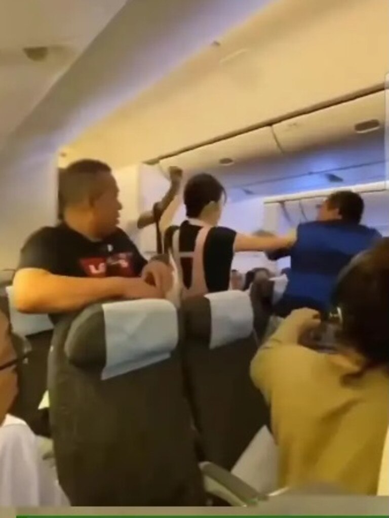 The men were handed over to police after landing.