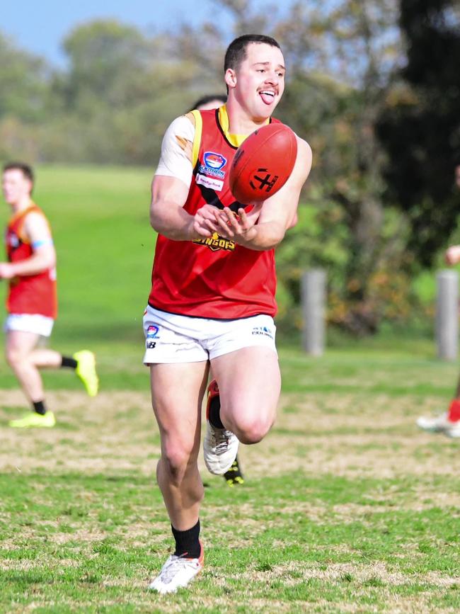 Mitch Cook fires out a handball. Picture: Jam_Visuals