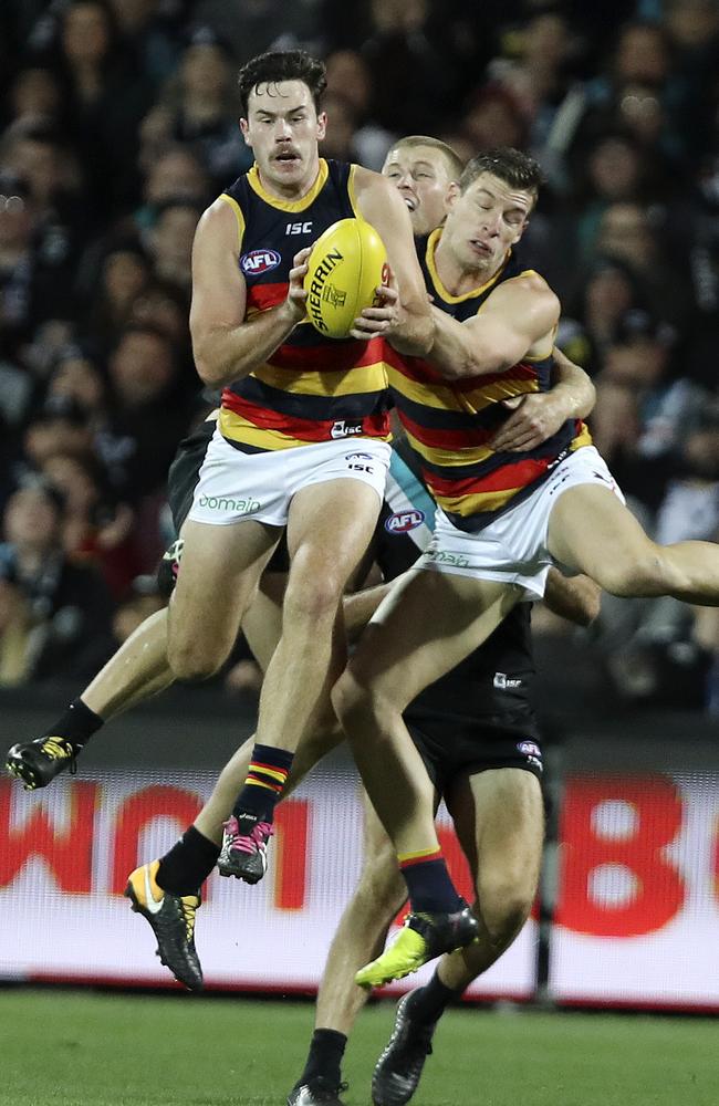 Mitch McGovern takes a strong mark and goals to put the Crows in front during the last quarter of Showdown 44 this year before Steve Motlop responded at the other end. Picture Sarah Reed