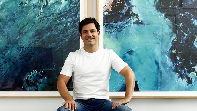 Tim Johnston with some of his ocean inspired artworks. Picture: John Appleyard