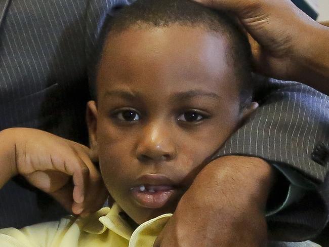 Raphael and Maribel Martinez comfort their son Andy after a press conference at their lawyer's office, Friday Sept. 30, 2016, in New York. Maribel Martinez has filed a lawsuit against JetBlue Airways for mixing up Andy with another boy and flying him to the wrong city. (AP Photo/Bebeto Matthews)