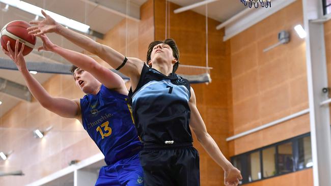 Thomas Joy (left) grabbing a rebound. GPS First V basktetball game between Churchie and Brisbane Boys Grammar. Saturday September 3, 2022. Picture, John Gass