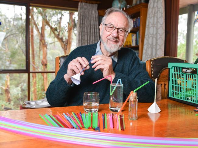 Dr Rob Morrison of the Curiosity Show with a plastic straw flute and siphon, Thursday, July 11, 2019. He says plastic straws are hugely useful in many educational activities and student projects, from constructions, hydraulics and meteorology to musical instruments, wheel bearings and molecular models.. (Pic: Brenton Edwards)