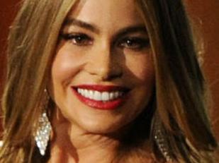 Sofia Vergara, left, and Television Academy CEO Bruce Rosenblum speak on stage at the 66th Annual Primetime Emmy Awards at the Nokia Theatre L.A. Live on Monday, Aug. 25, 2014, in Los Angeles. (Photo by Chris Pizzello/Invision/AP)