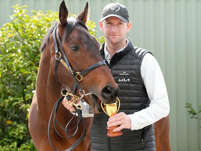 Caulfield Cup Winner Duke De Sessa has a taste of the trainer’s trophy with Ciaron Maher’s assistant, Jack Turnbull, at Cranbourne on Sunday. Picture: George Sal / Racing Photos