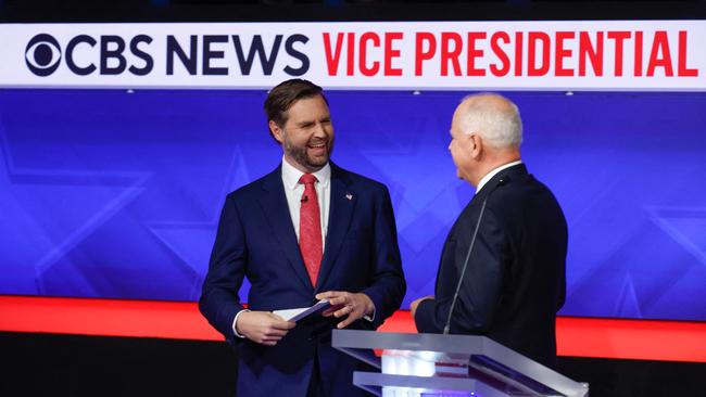 Tim Walz and JD Vance speak after a debate at the CBS Broadcast Center.