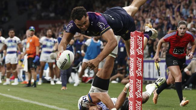 MELBOURNE, AUSTRALIA - MARCH 16: Xavier Coates of the Storm scores the match winning try during the round two NRL match between Melbourne Storm and New Zealand Warriors at AAMI Park, on March 16, 2024, in Melbourne, Australia. (Photo by Daniel Pockett/Getty Images)