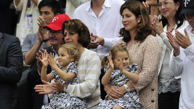 Mirka Federer (R), wife of Roger Federer with their twin two year old daughters, Myla Rose and Charlene Riva, in 2012. Picture: AFP