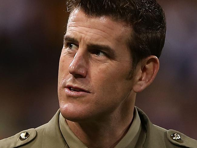 PERTH, AUSTRALIA - APRIL 26:  Corporal Ben Roberts-Smith acknowledges the spectators before the start of the round five AFL match between the Fremantle Dockers and the Richmond Tigers at Patersons Stadium on April 26, 2013 in Perth, Australia.  (Photo by Paul Kane/Getty Images)