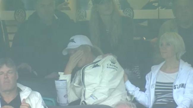 Julie Burgess appears visibly distressed as son Sam is stretchered off the SCG with a neck injury.