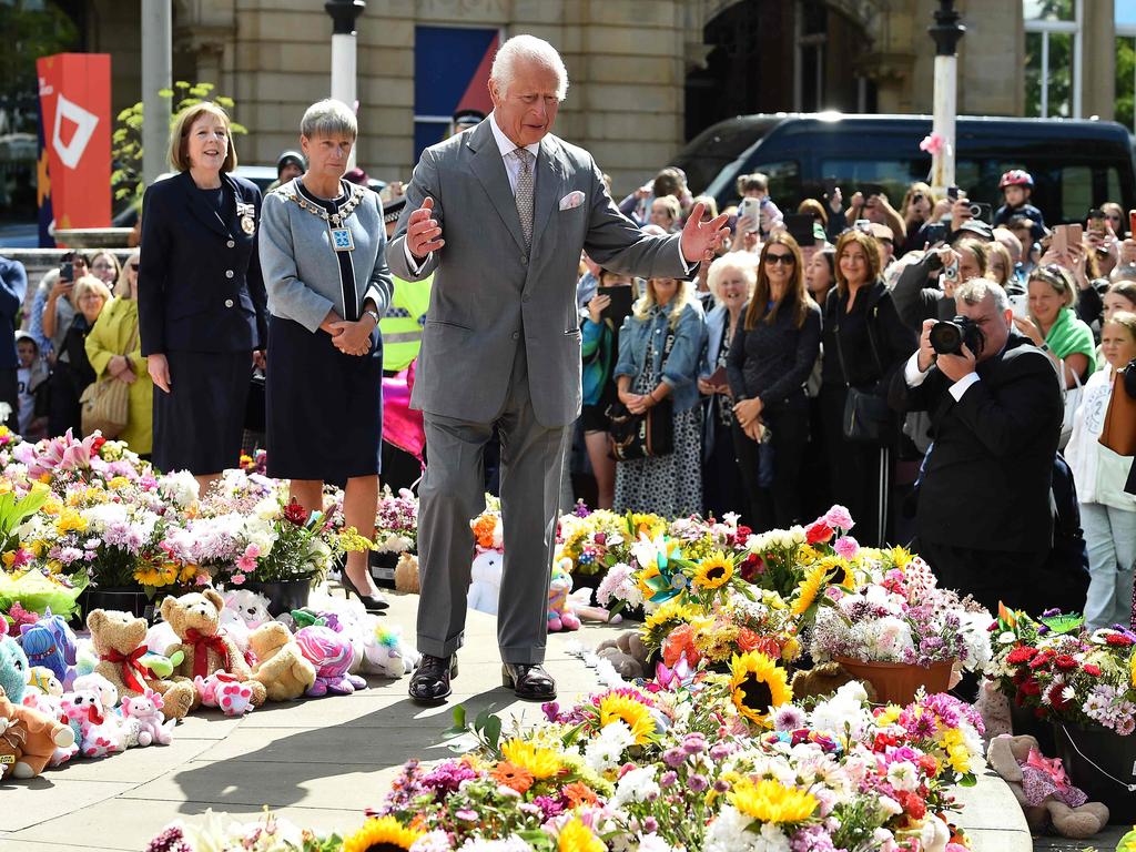 King Charles views tributes outside Southport Town Hall after the murder of three girls at a Taylor Swift dance class. Picture: AFP