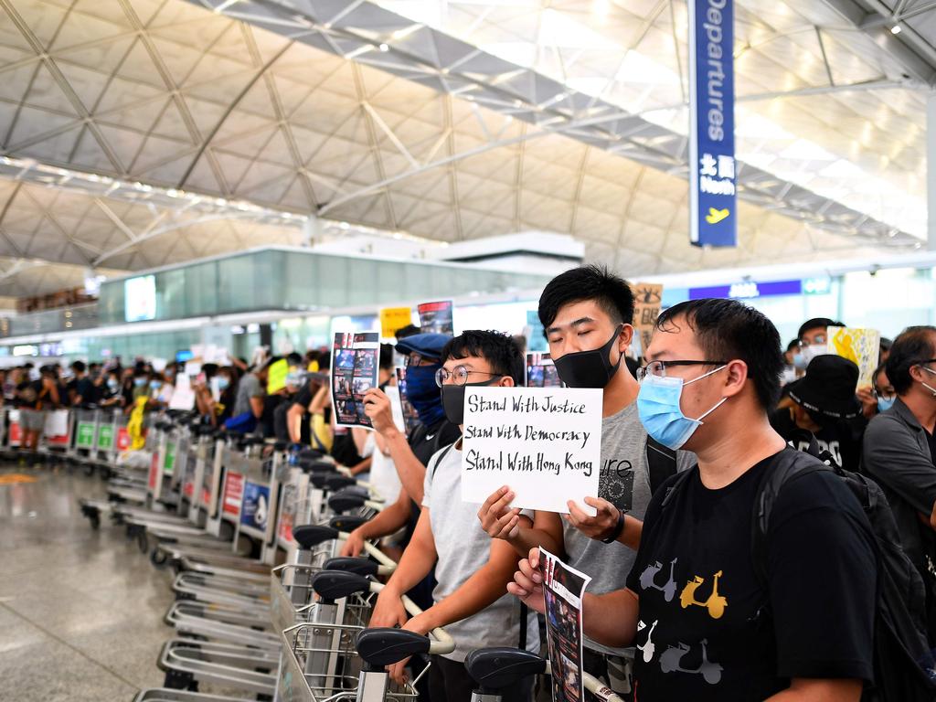 Hong Kong pro-democracy protesters block the departure gate. Picture: Manan Vatsyayana/AFP